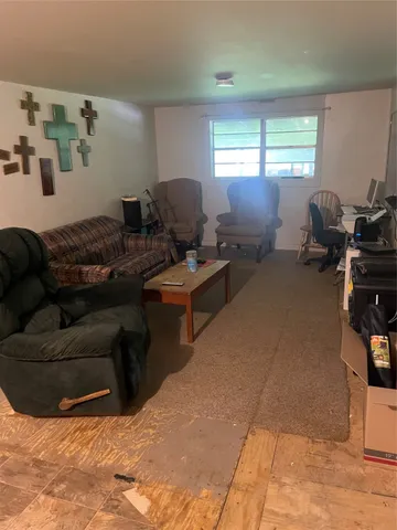 a living room with furniture window and a window