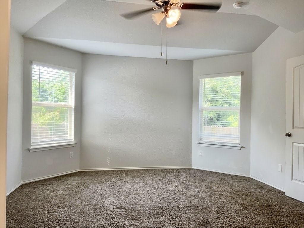 124 Marcel Court Taylor, TX 76574 - Photo 7 of 17 Primary bedroom with coffered ceiling, carpet and natural light