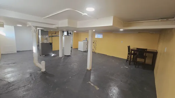 a view of a hallway with seating space