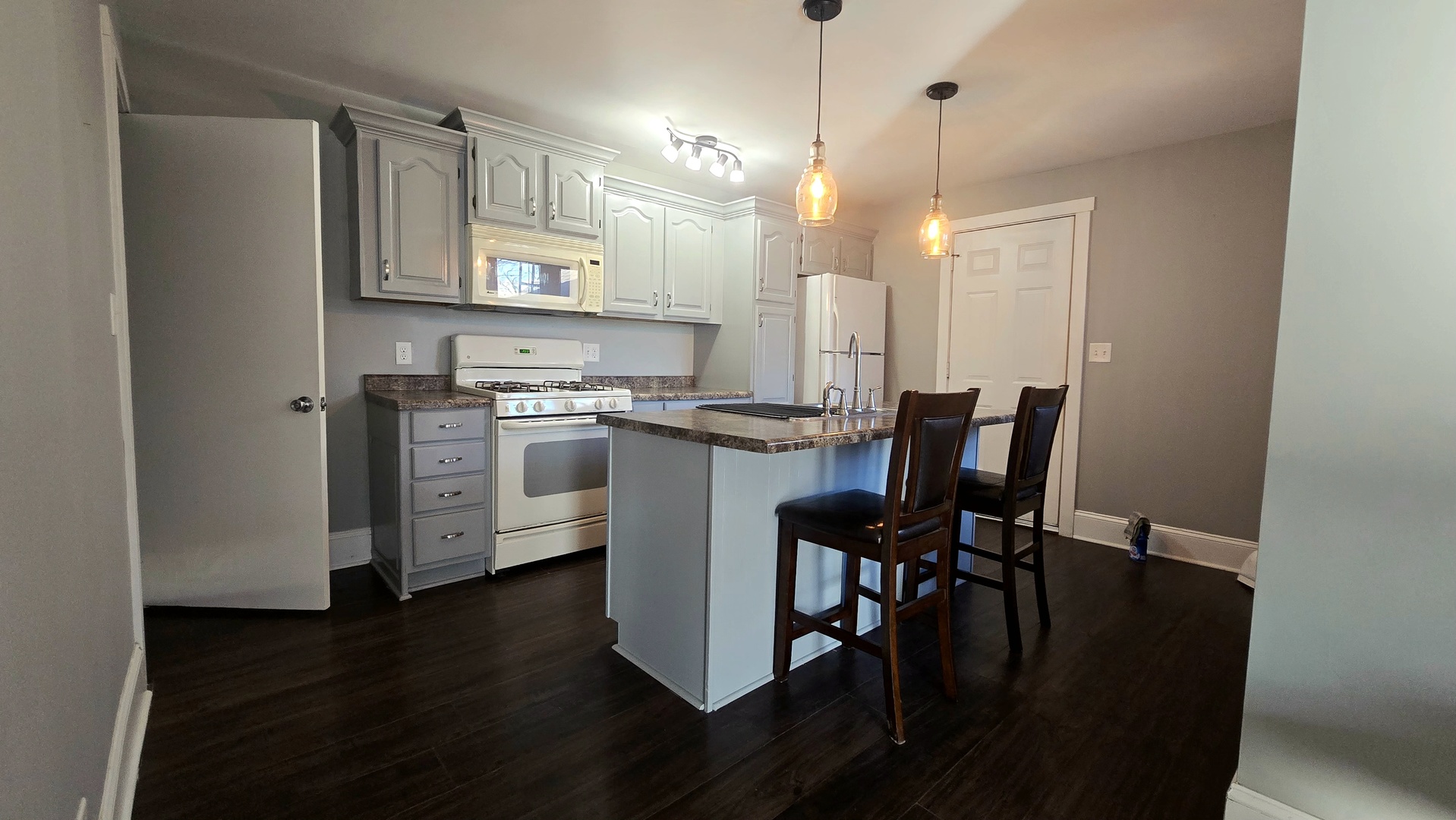 595 West Bridge Street Kankakee, IL 60901 - Photo 7 of 27 a view of a dining room with furniture and wooden floor
