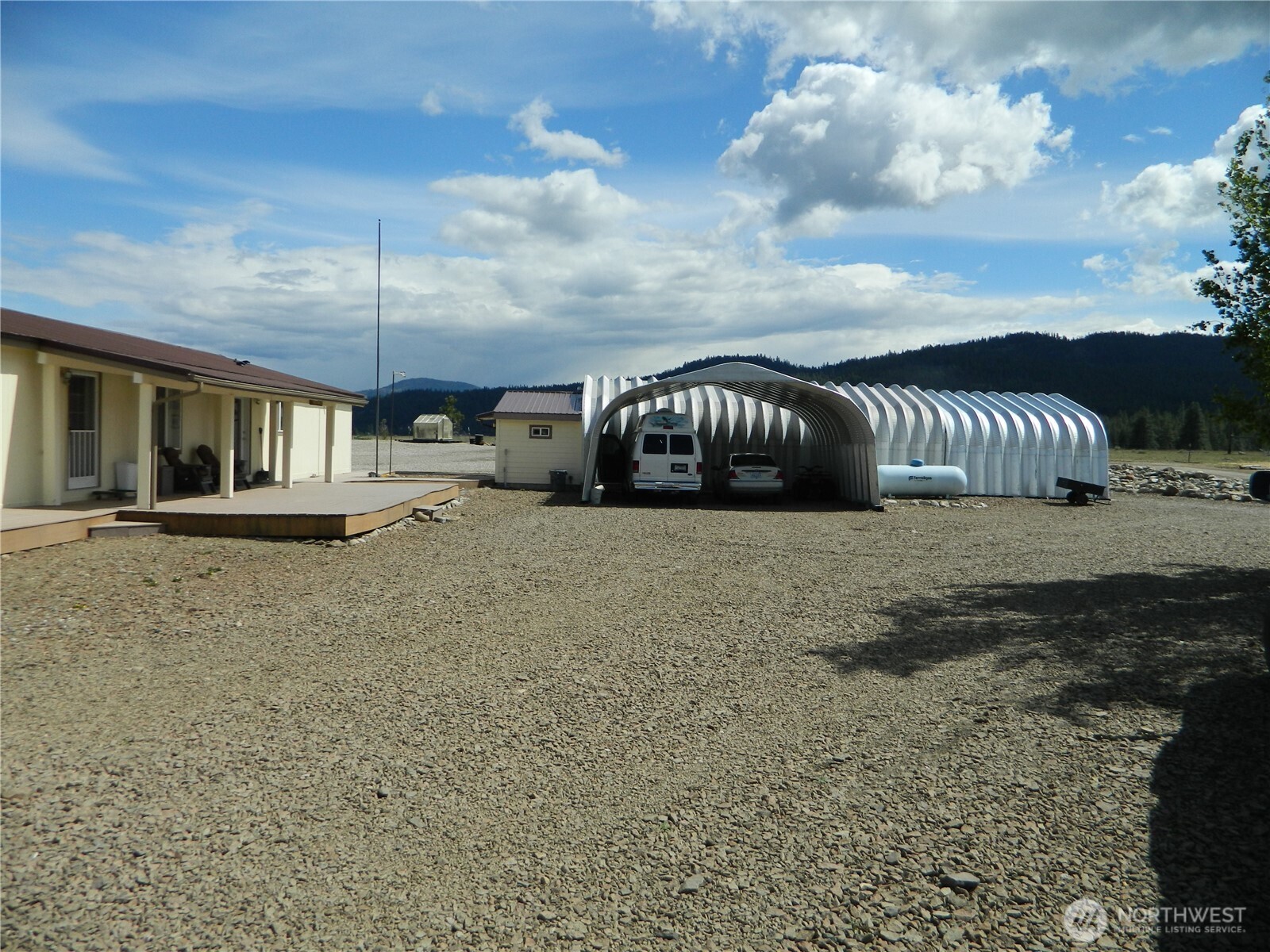 29 Duck Flats Road Tonasket, WA 98855 - Photo 8 of 25 a view of a house with a porch