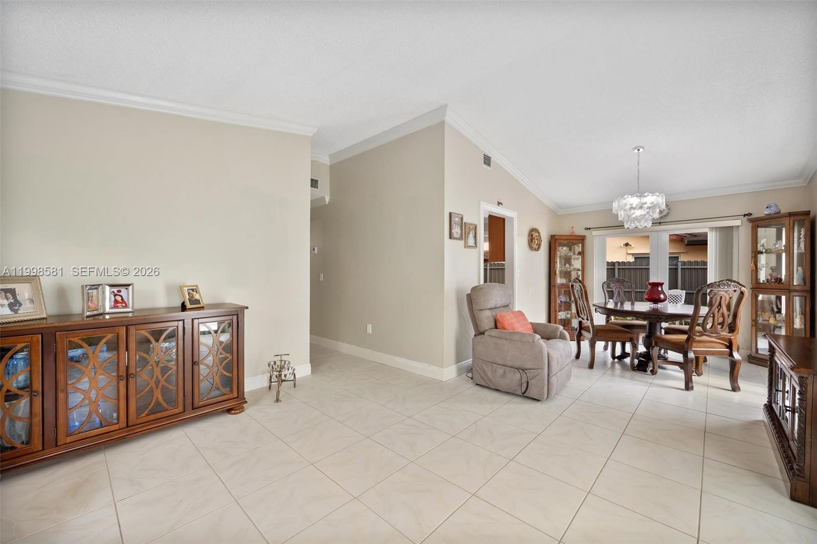 4218 Southwest 138th Court Miami, FL 33175 - Photo 11 of 24 a living room with furniture and a dining table