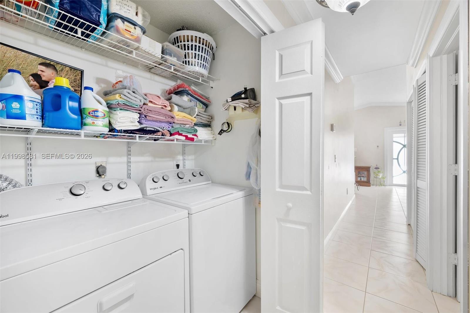 4218 Southwest 138th Court Miami, FL 33175 - Photo 16 of 24 a view of storage and utility room with washer and dryer