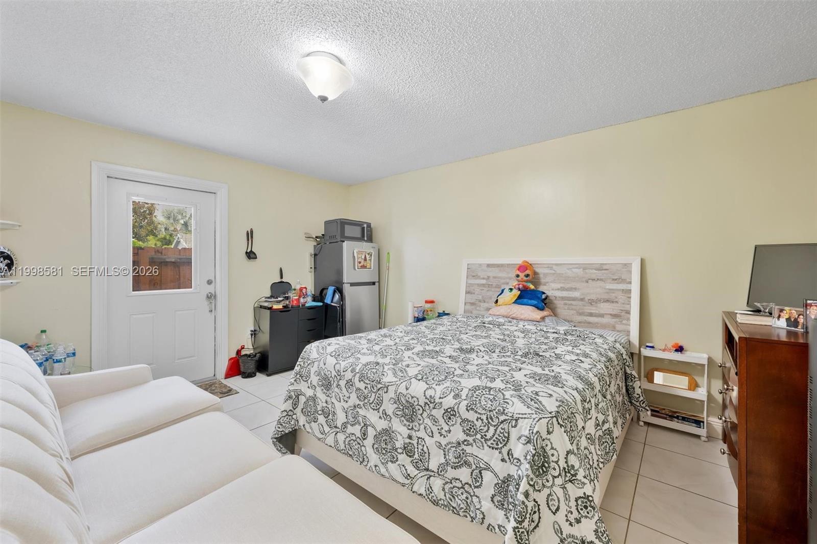 4218 Southwest 138th Court Miami, FL 33175 - Photo 19 of 24 a bedroom with a bed and wooden floor