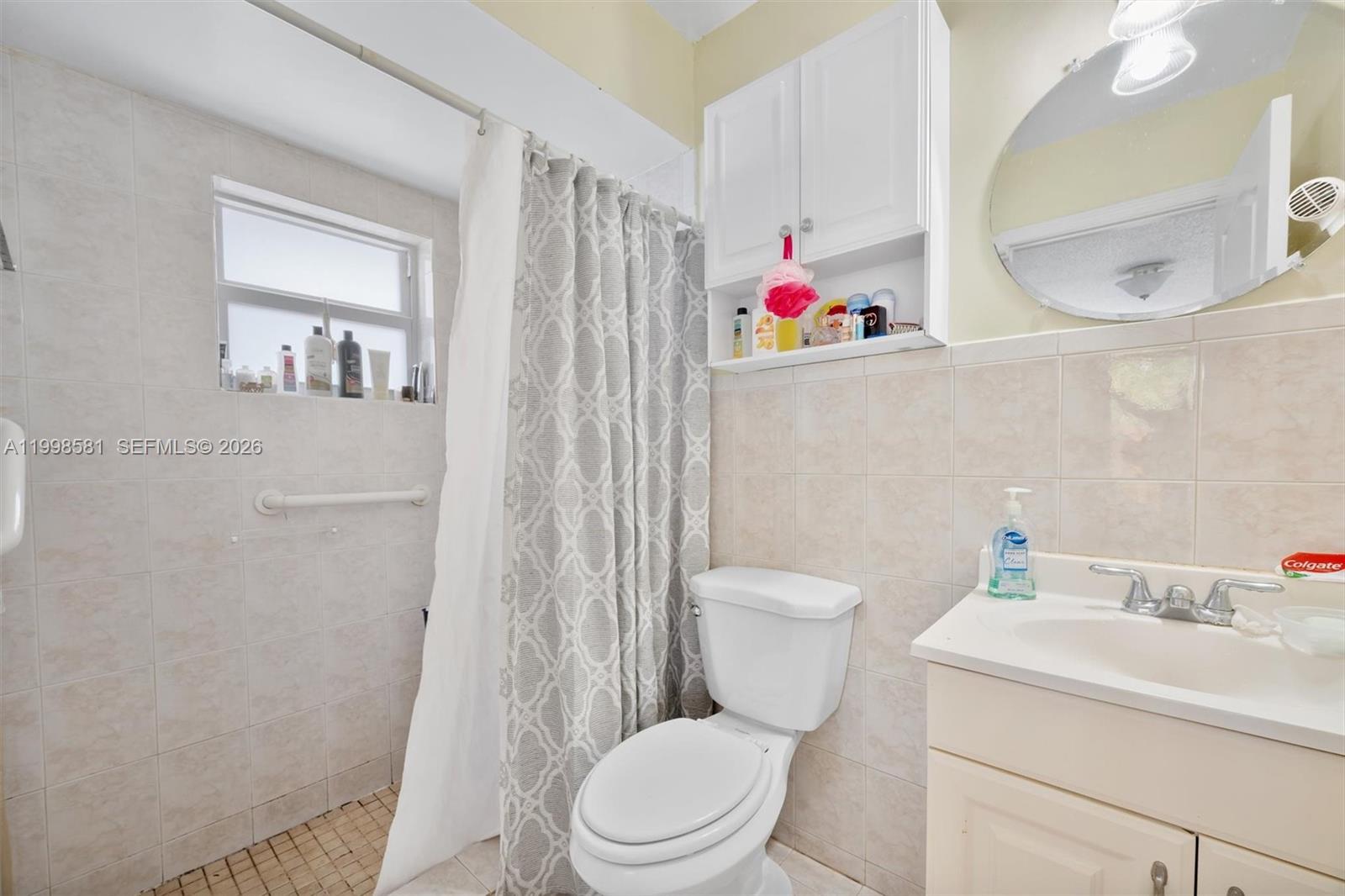 4218 Southwest 138th Court Miami, FL 33175 - Photo 20 of 24 a white toilet sitting next to a bathroom sink