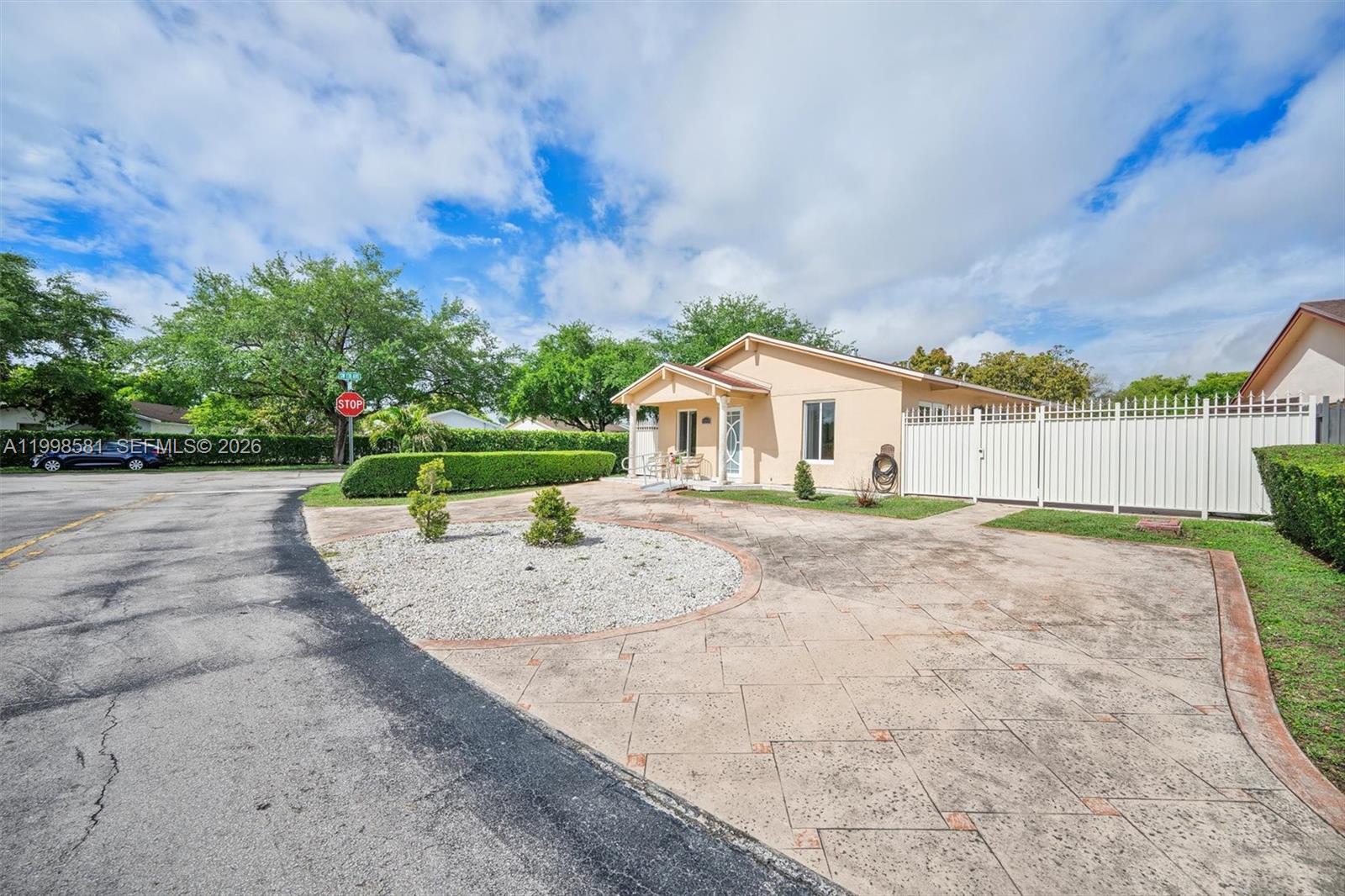 4218 Southwest 138th Court Miami, FL 33175 - Photo 2 of 24 a view of a house with a yard and fence