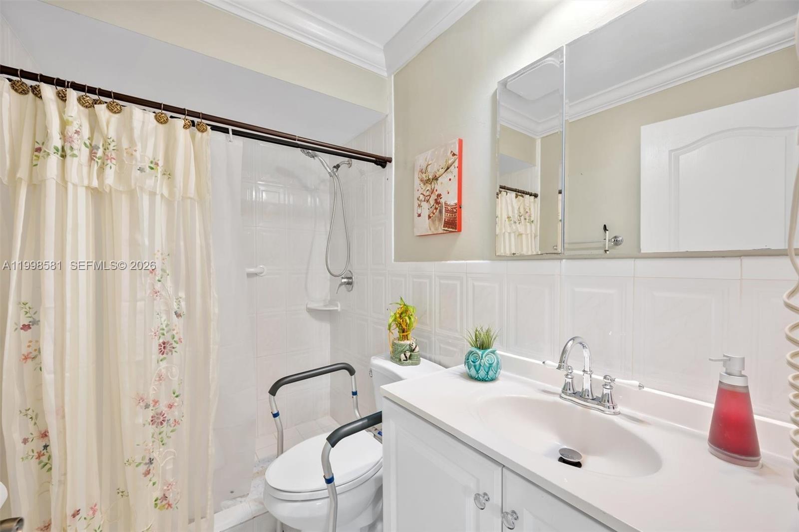 4218 Southwest 138th Court Miami, FL 33175 - Photo 21 of 24 a bathroom with a sink toilet and shower