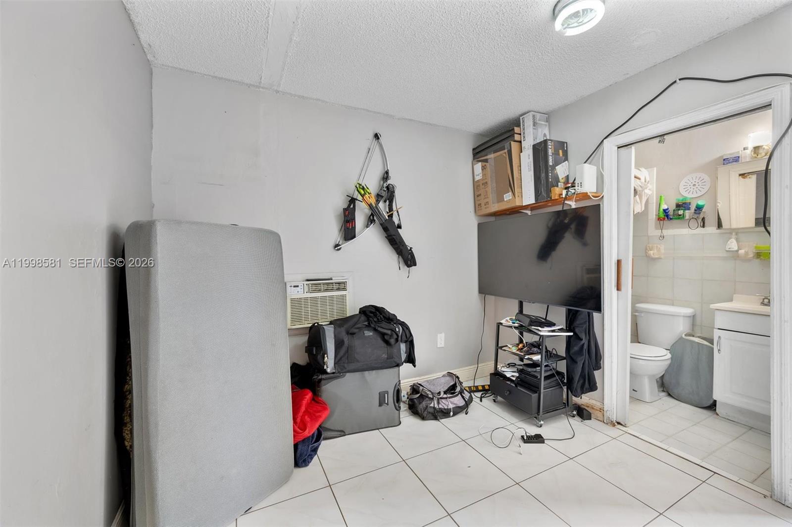 4218 Southwest 138th Court Miami, FL 33175 - Photo 22 of 24 a view of living room with furniture and a window