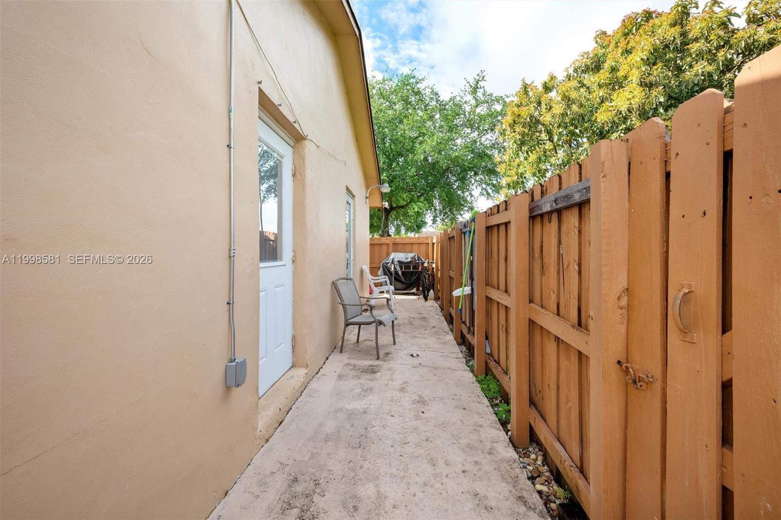 4218 Southwest 138th Court Miami, FL 33175 - Photo 6 of 24 a view of a patio with wooden floor and fence