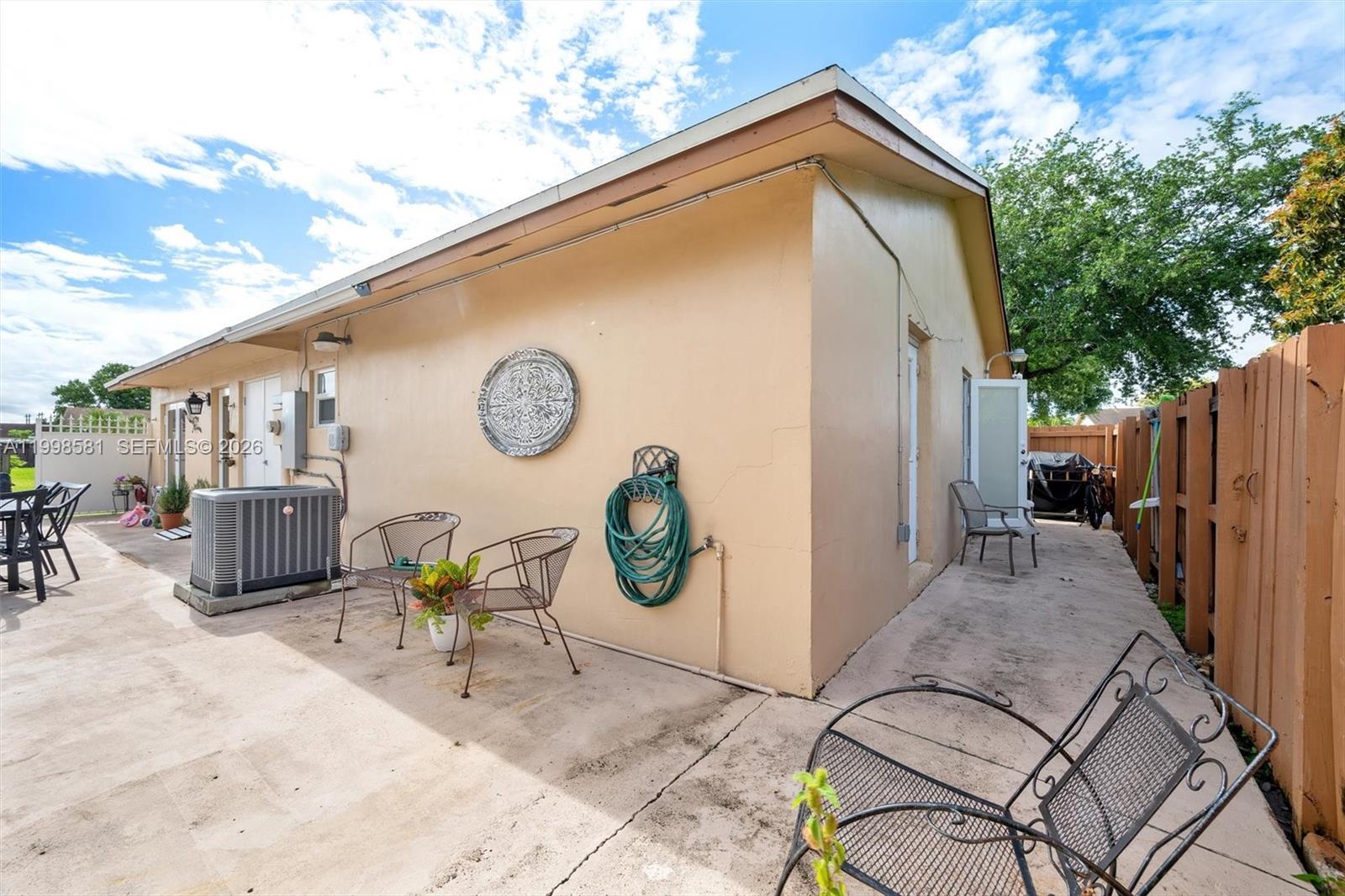 4218 Southwest 138th Court Miami, FL 33175 - Photo 7 of 24 a view of backyard with outdoor seating and plants