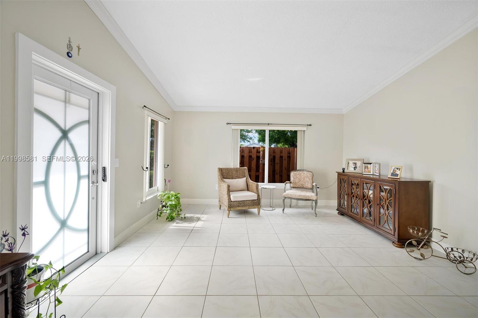 4218 Southwest 138th Court Miami, FL 33175 - Photo 9 of 24 a living room with furniture and a table