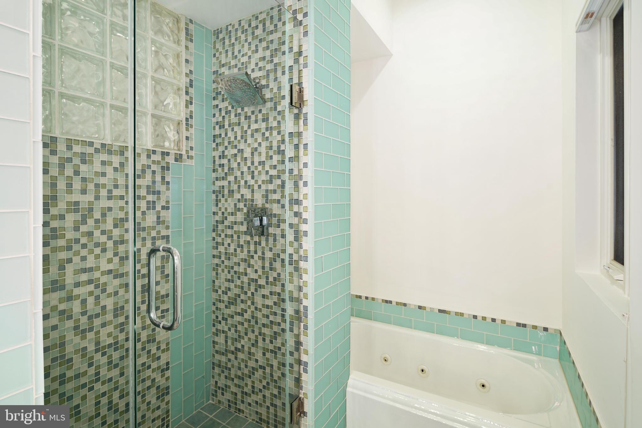2028 Locust Street Philadelphia, PA 19103 - Photo 16 of 31 a bathroom with a bathtub and shower