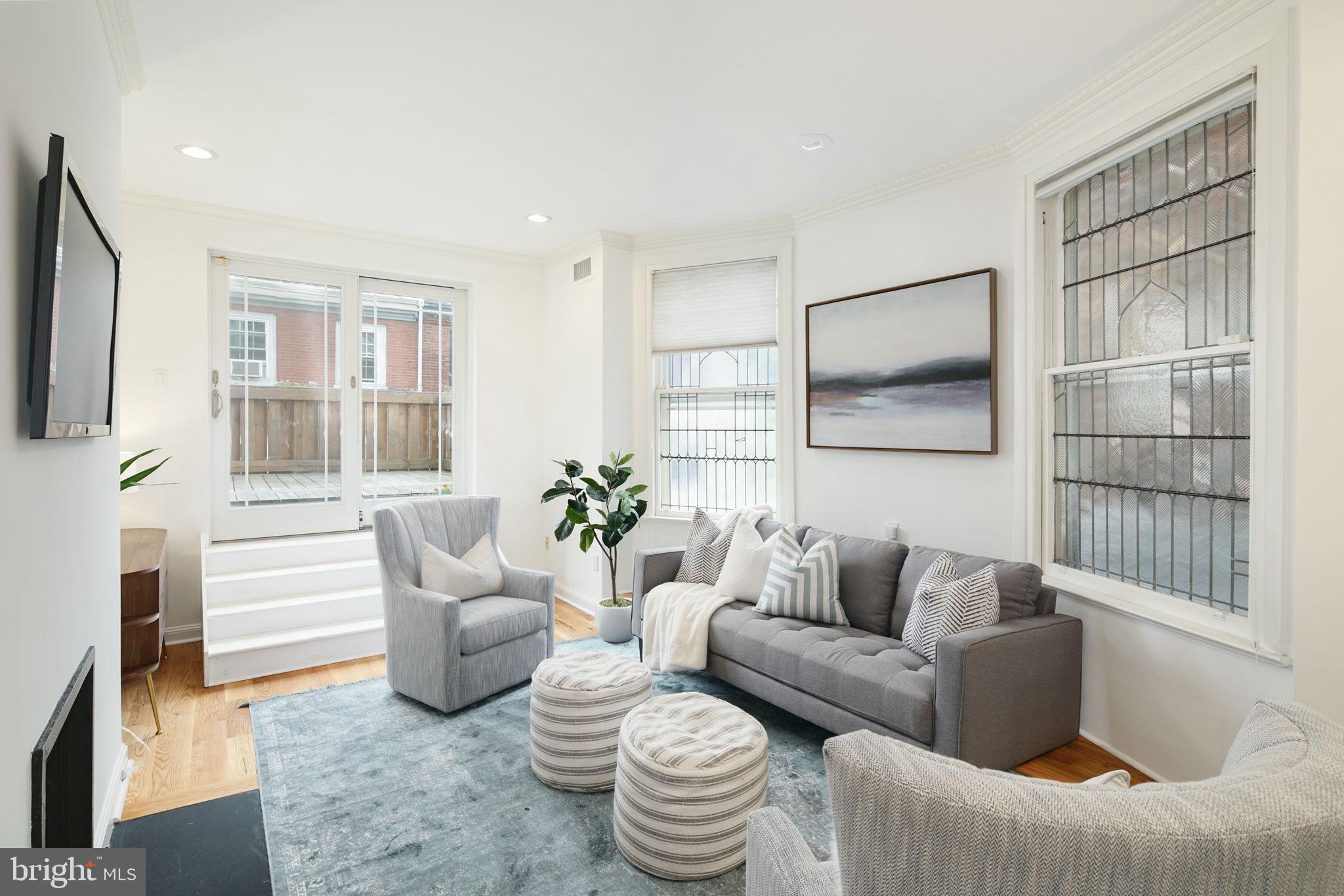 2028 Locust Street Philadelphia, PA 19103 - Photo 17 of 31 a living room with furniture and a potted plant