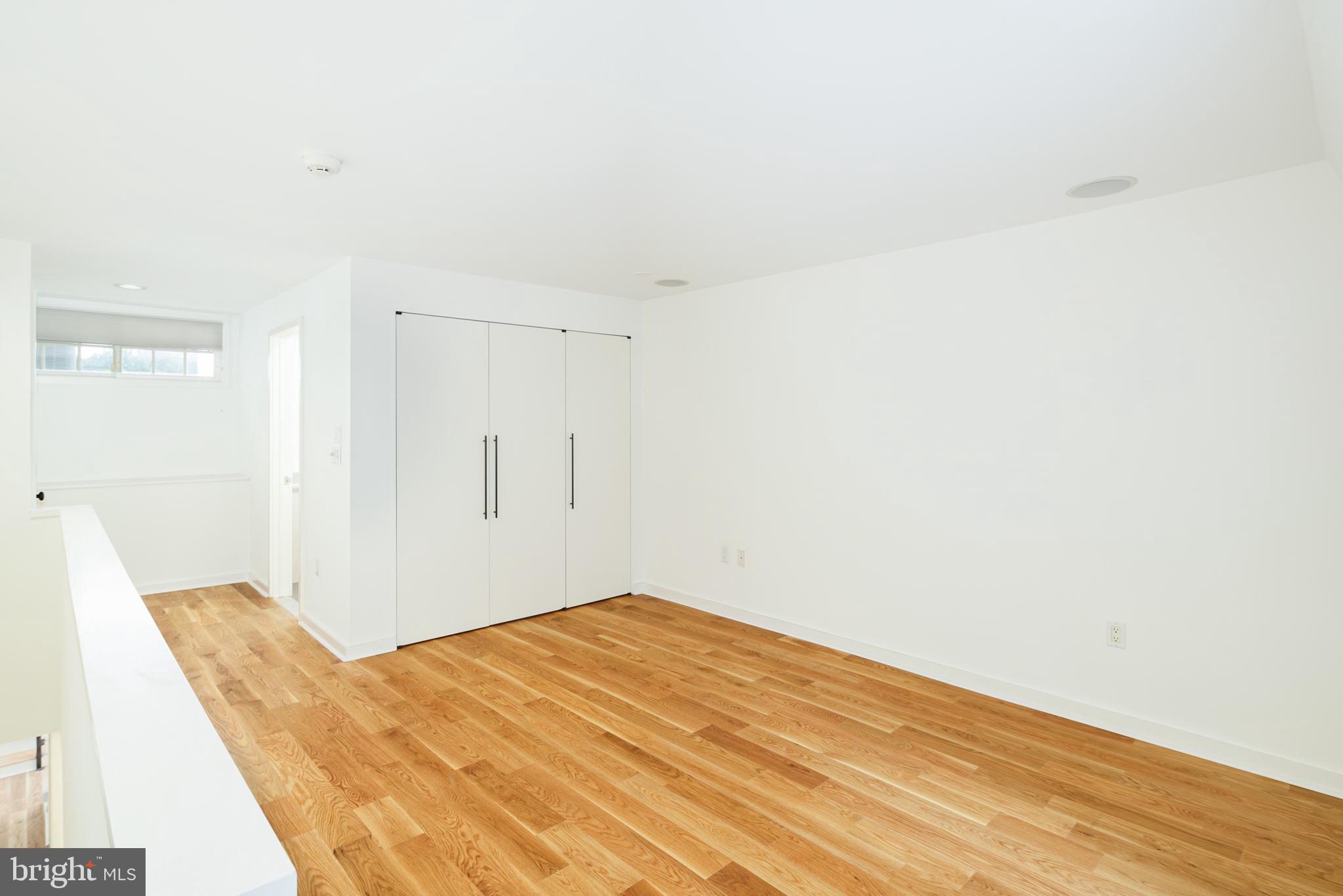 2028 Locust Street Philadelphia, PA 19103 - Photo 24 of 31 a bedroom with a bed and a rug