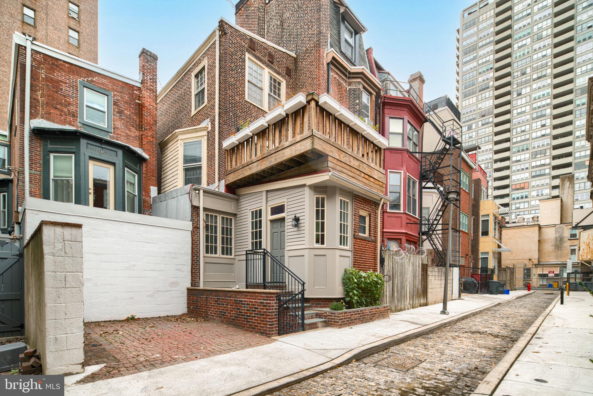 2028 Locust Street Philadelphia, PA 19103 - Photo 30 of 31 a view of a brick building with many windows