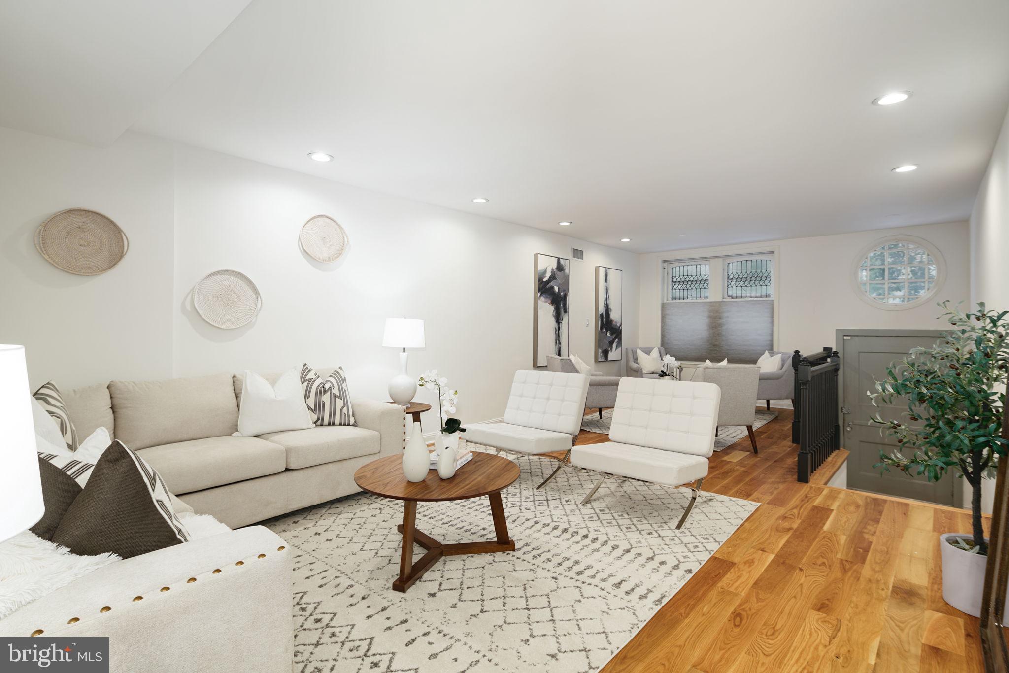 2028 Locust Street Philadelphia, PA 19103 - Photo 3 of 31 a living room with furniture and a rug