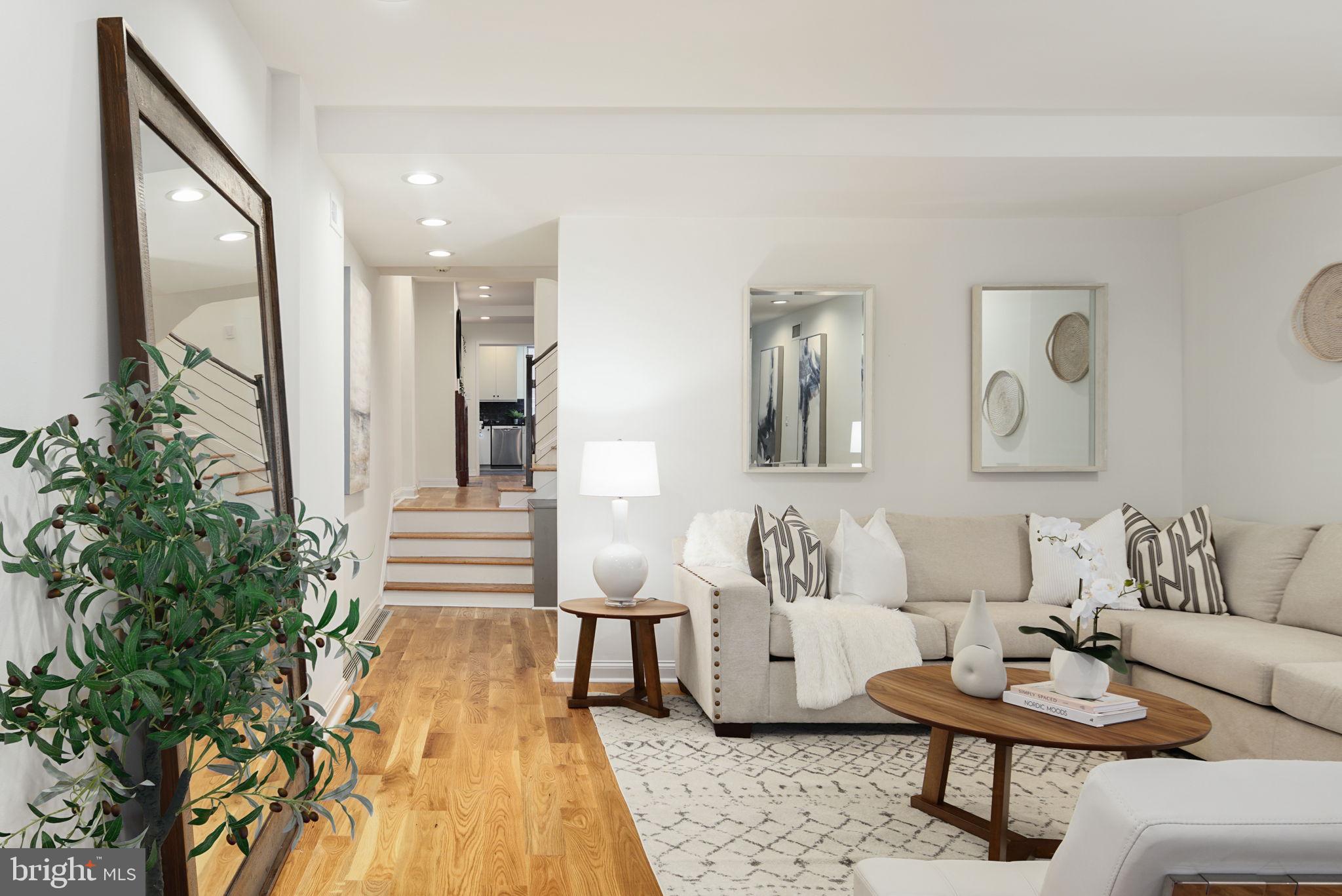 2028 Locust Street Philadelphia, PA 19103 - Photo 4 of 31 a living room with furniture and a potted plant