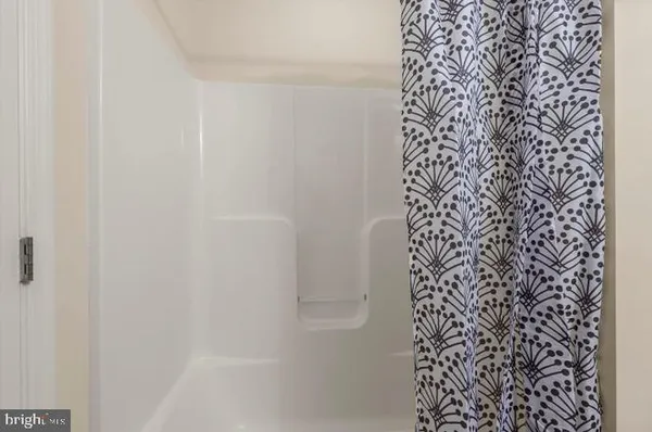 a bathroom with a shower curtain