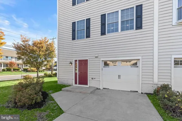 a view of a house with a yard and garage