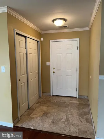 an entryway view with wooden floor
