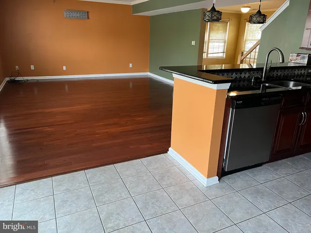 a view of a utility room with cabinets