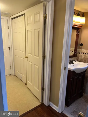 a bathroom with a sink a mirror and a shower