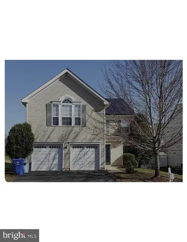 a black and white photo of a house