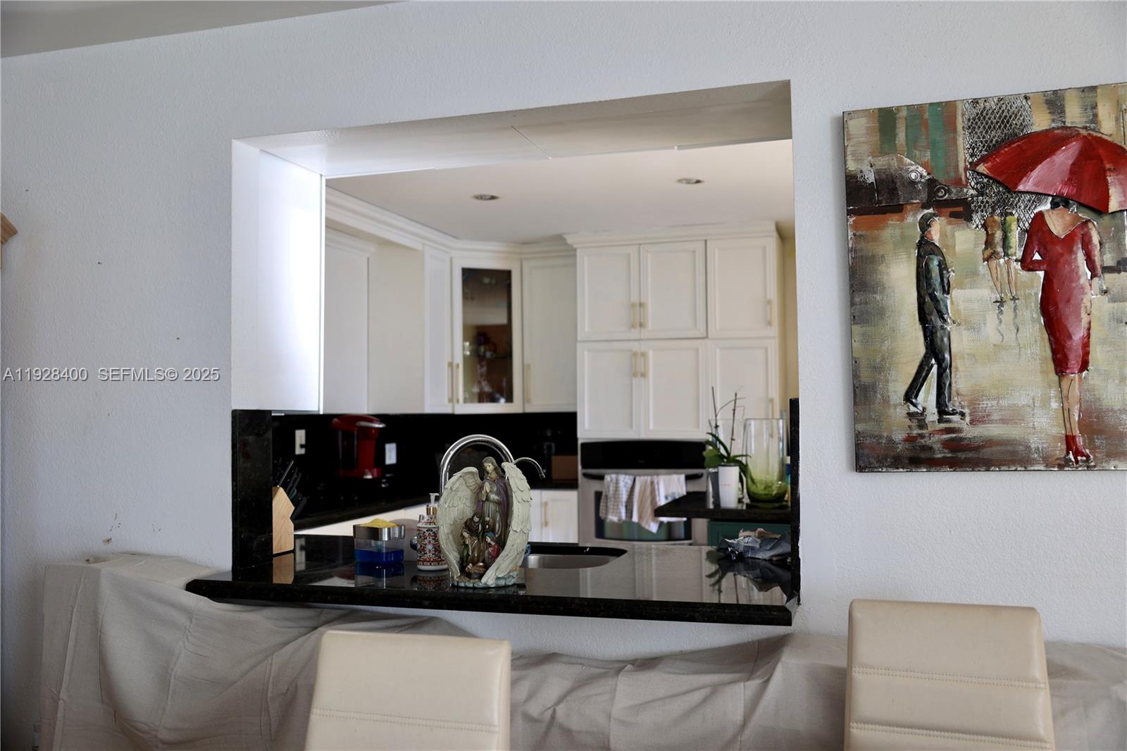 11049 Southwest 152nd Court Miami, FL 33196 - Photo 15 of 57 a kitchen with a sink and a stove top oven