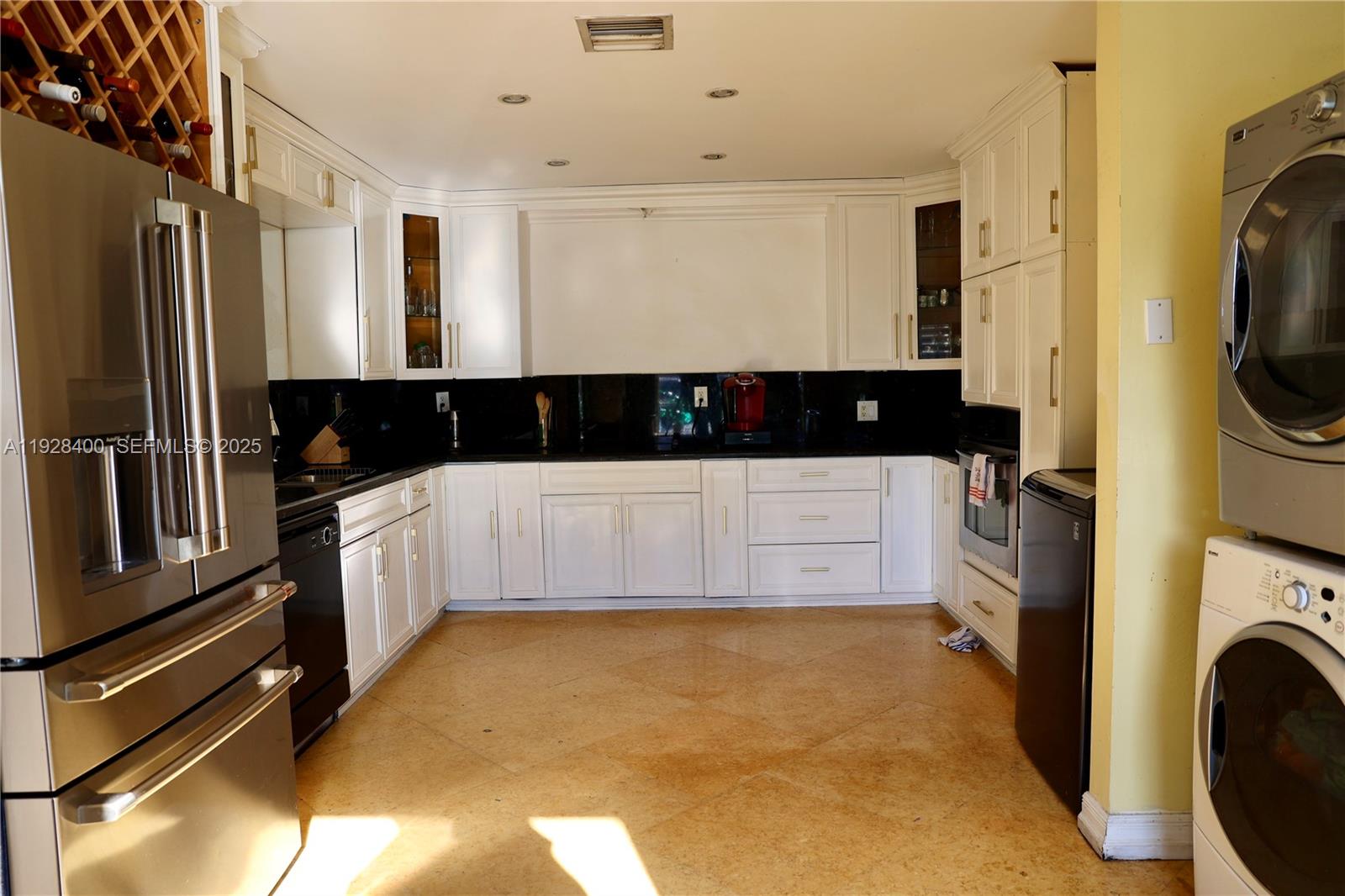 11049 Southwest 152nd Court Miami, FL 33196 - Photo 18 of 57 a bathroom with a tub sink and a washing machine
