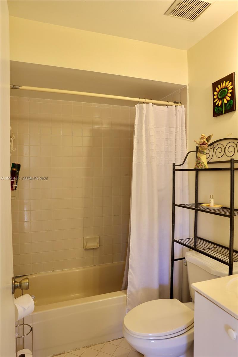 11049 Southwest 152nd Court Miami, FL 33196 - Photo 26 of 57 a bathroom with a toilet and a shower