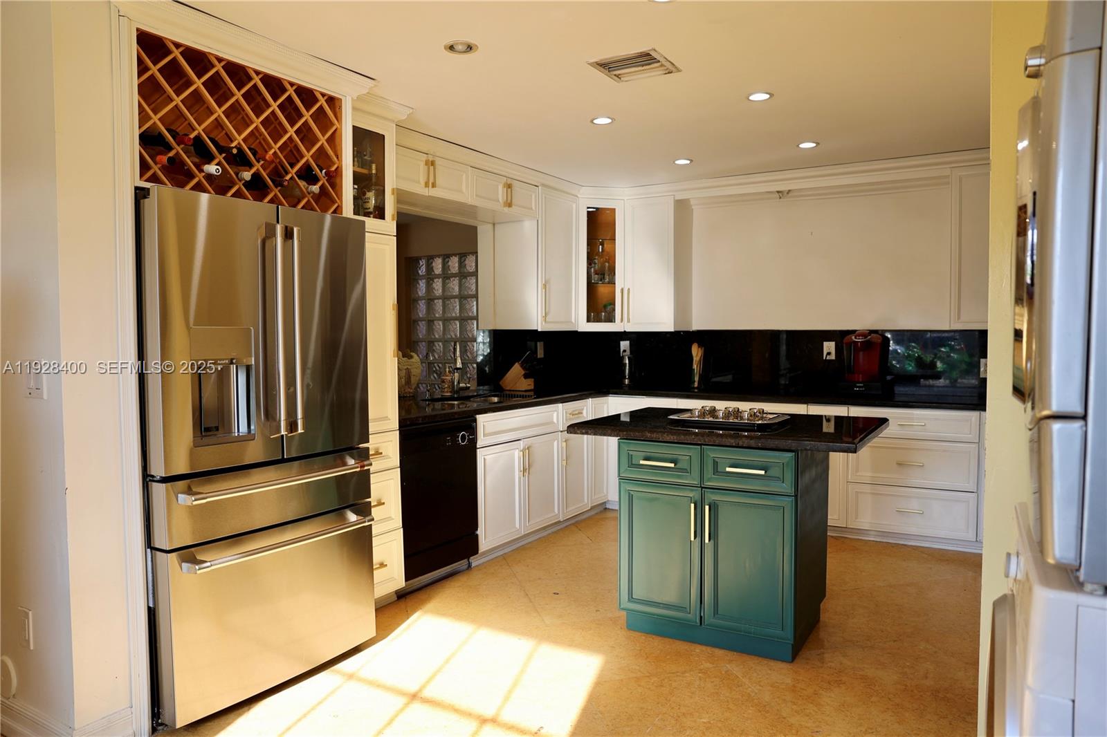 11049 Southwest 152nd Court Miami, FL 33196 - Photo 28 of 57 a kitchen with a refrigerator and a stove top oven