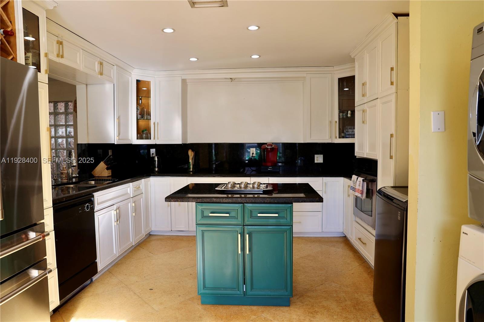 11049 Southwest 152nd Court Miami, FL 33196 - Photo 29 of 57 a kitchen with stainless steel appliances granite countertop a stove a sink and a refrigerator