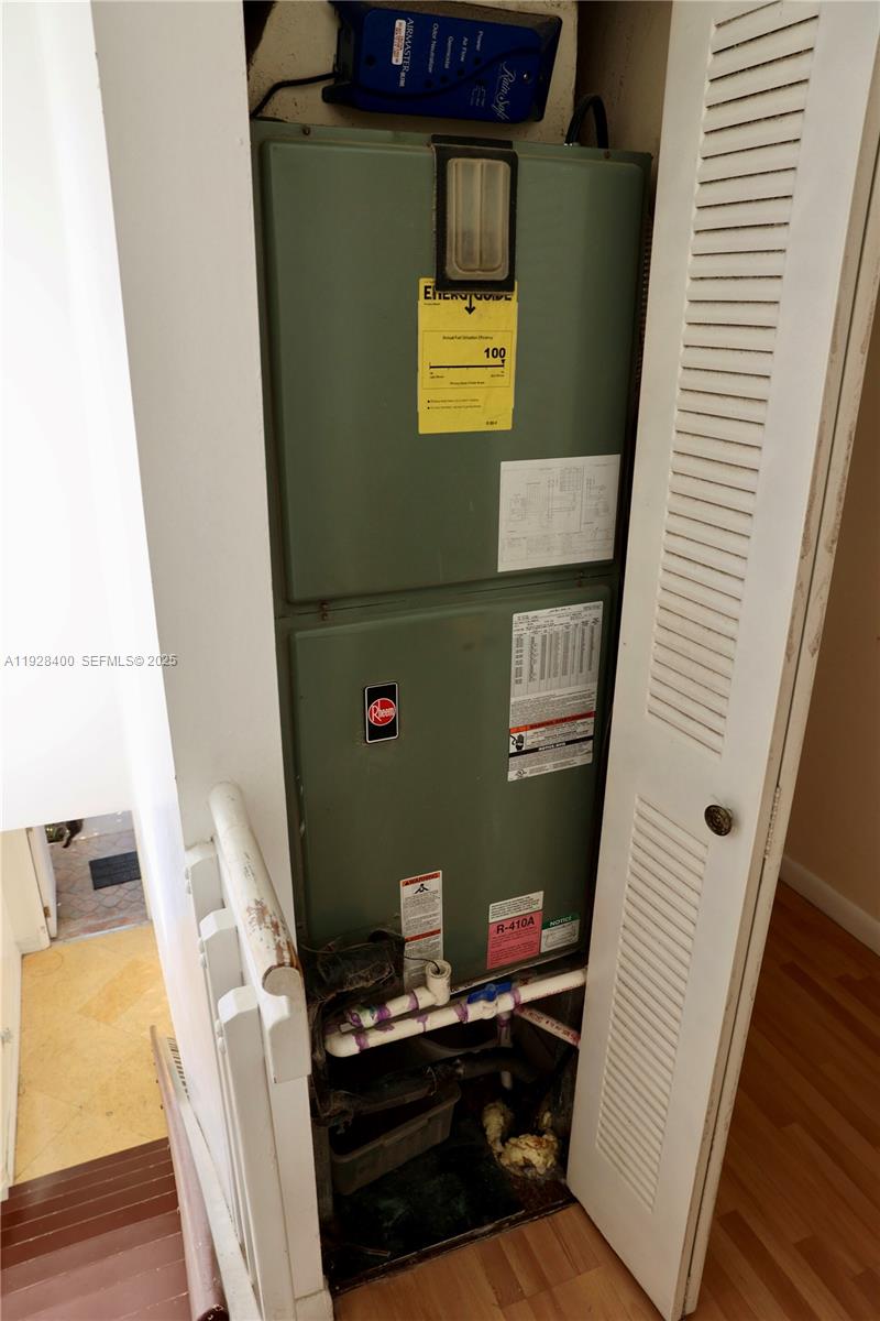 11049 Southwest 152nd Court Miami, FL 33196 - Photo 30 of 57 a view of a workspace with furniture and wooden floor