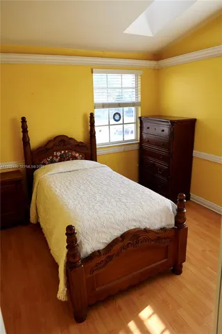 a view of a livingroom with an empty space and a window