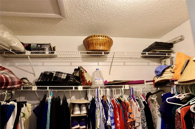 a bathroom with a double vanity sink toilet and shower