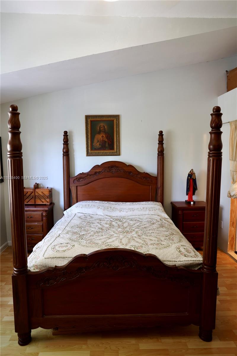 11049 Southwest 152nd Court Miami, FL 33196 - Photo 42 of 57 a bedroom with a bed and dresser