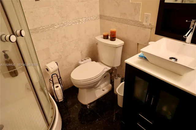 an aerial view of multiple houses with yard