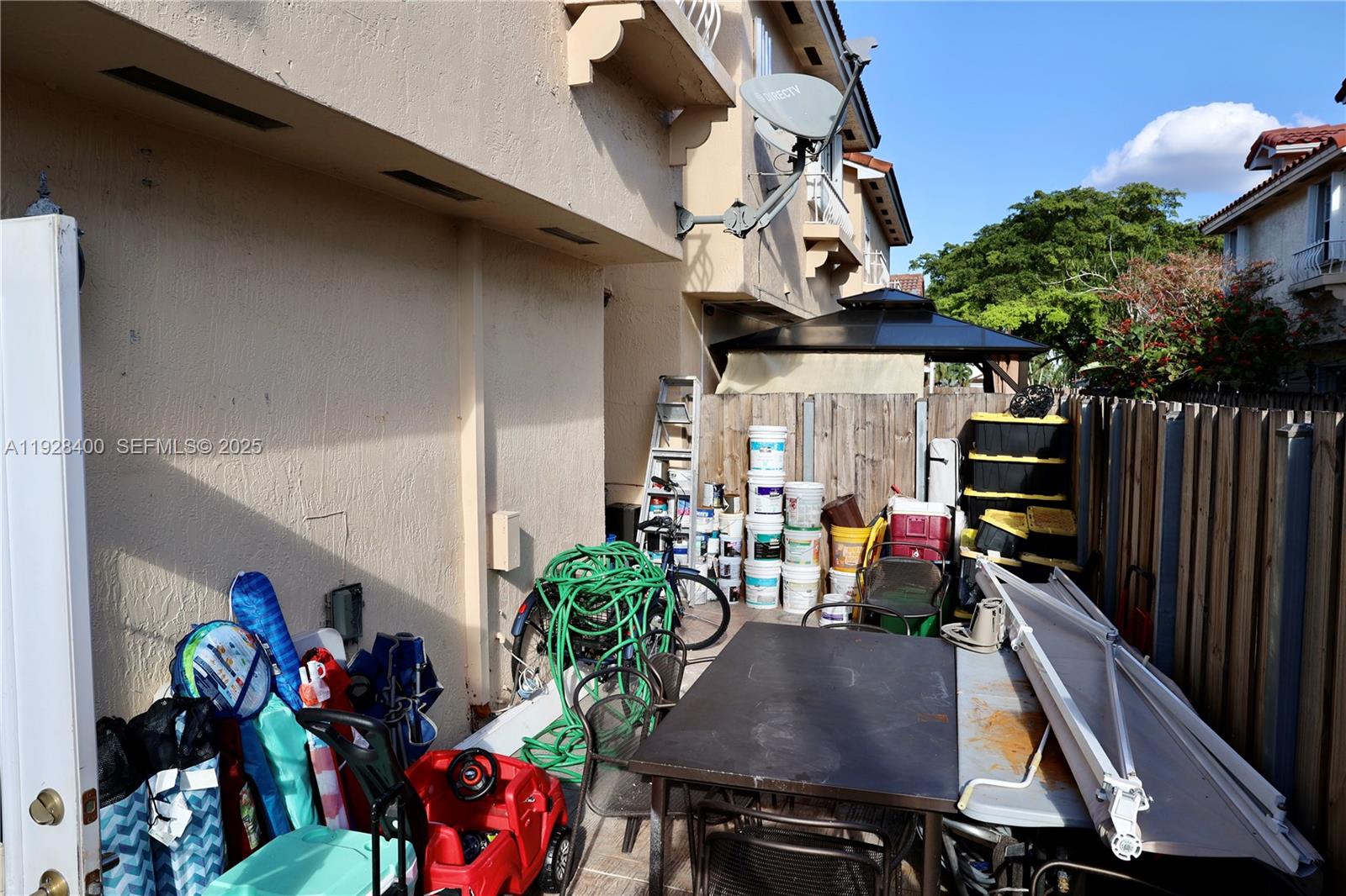 11049 Southwest 152nd Court Miami, FL 33196 - Photo 50 of 57 a view of a chairs and table in a patio