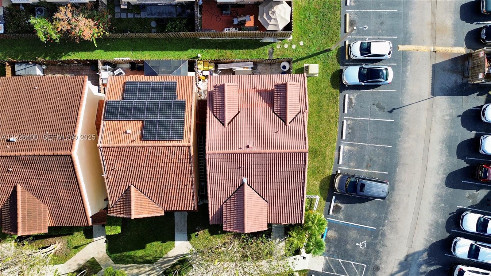 11049 Southwest 152nd Court Miami, FL 33196 - Photo 54 of 57 an aerial view of residential houses with outdoor space and parking