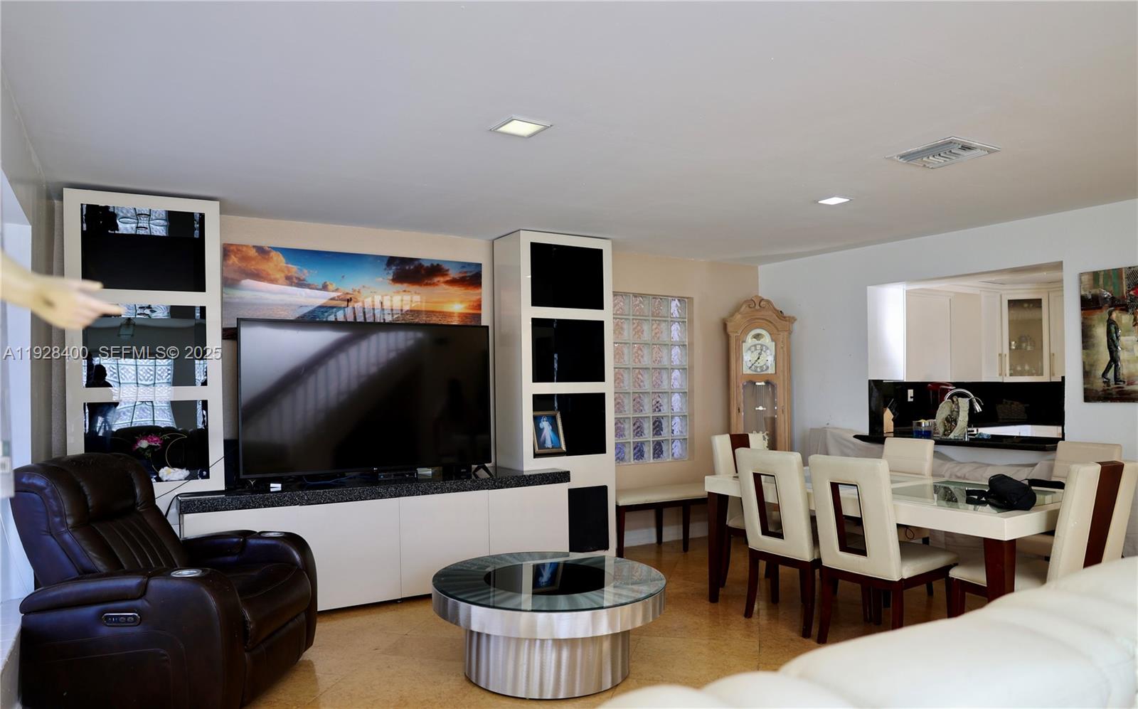 11049 Southwest 152nd Court Miami, FL 33196 - Photo 7 of 57 a living room with furniture a flat screen tv and a fireplace