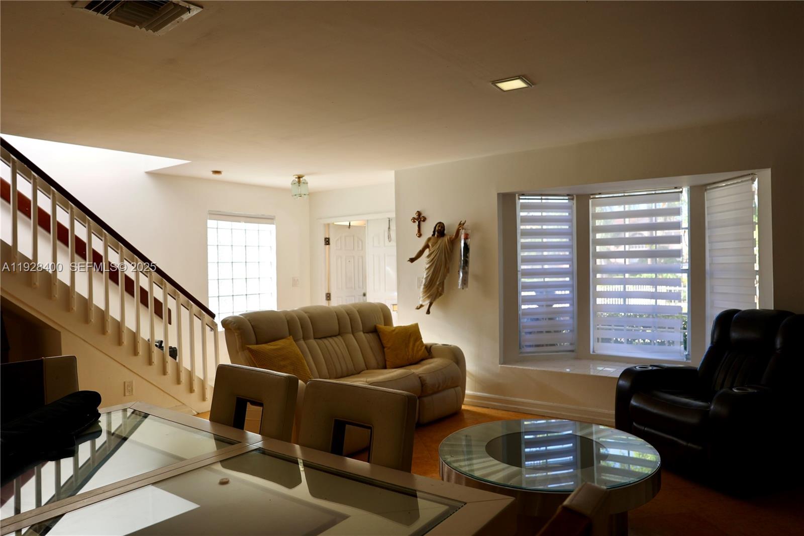 11049 Southwest 152nd Court Miami, FL 33196 - Photo 9 of 57 a living room with furniture and a large window
