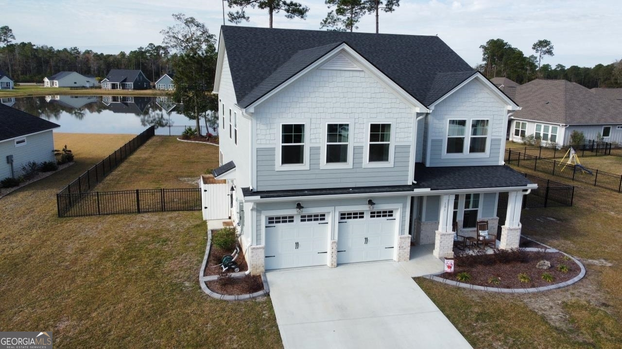 a front view of a house with garden