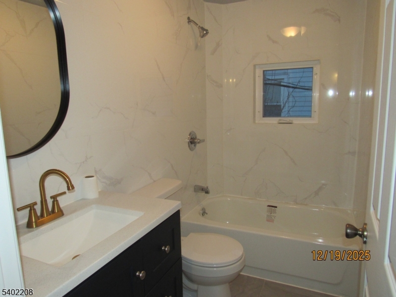 552 Milford Frenchtown Road Milford, NJ 08848 - Photo 16 of 26 a bathroom with a sink mirror toilet and bathtub