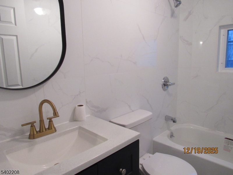 552 Milford Frenchtown Road Milford, NJ 08848 - Photo 17 of 26 a bathroom with a sink a toilet and a mirror