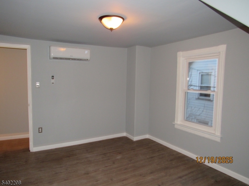 552 Milford Frenchtown Road Milford, NJ 08848 - Photo 20 of 26 an empty room with wooden floor and windows