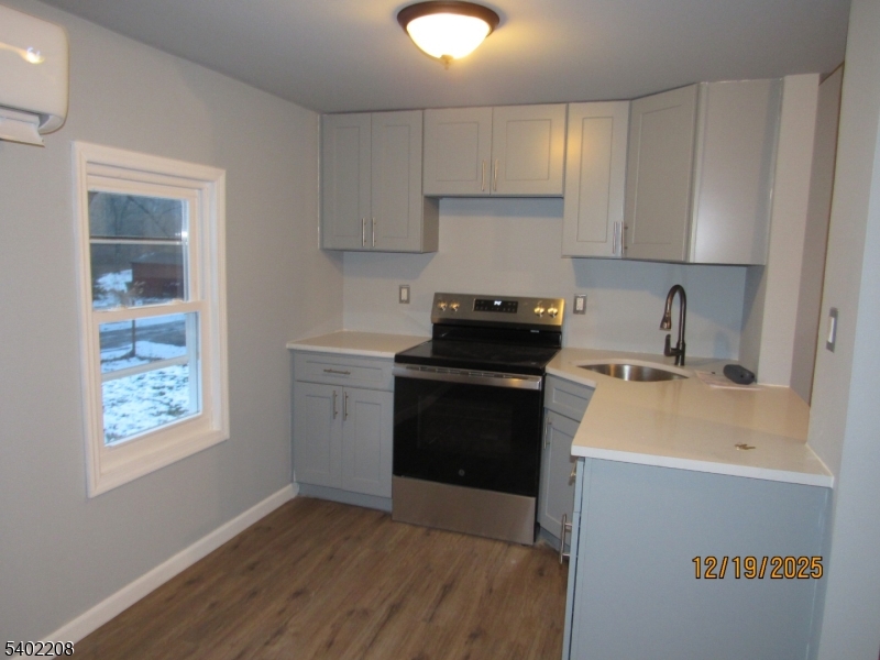 552 Milford Frenchtown Road Milford, NJ 08848 - Photo 5 of 26 a kitchen with a sink stove and cabinets