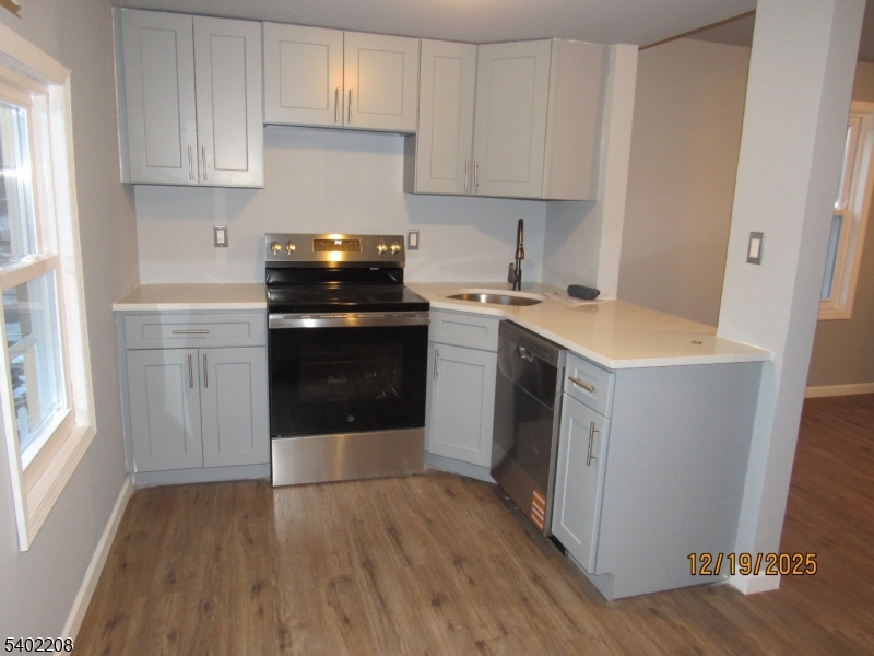 552 Milford Frenchtown Road Milford, NJ 08848 - Photo 6 of 26 a kitchen with a stove sink and cabinets