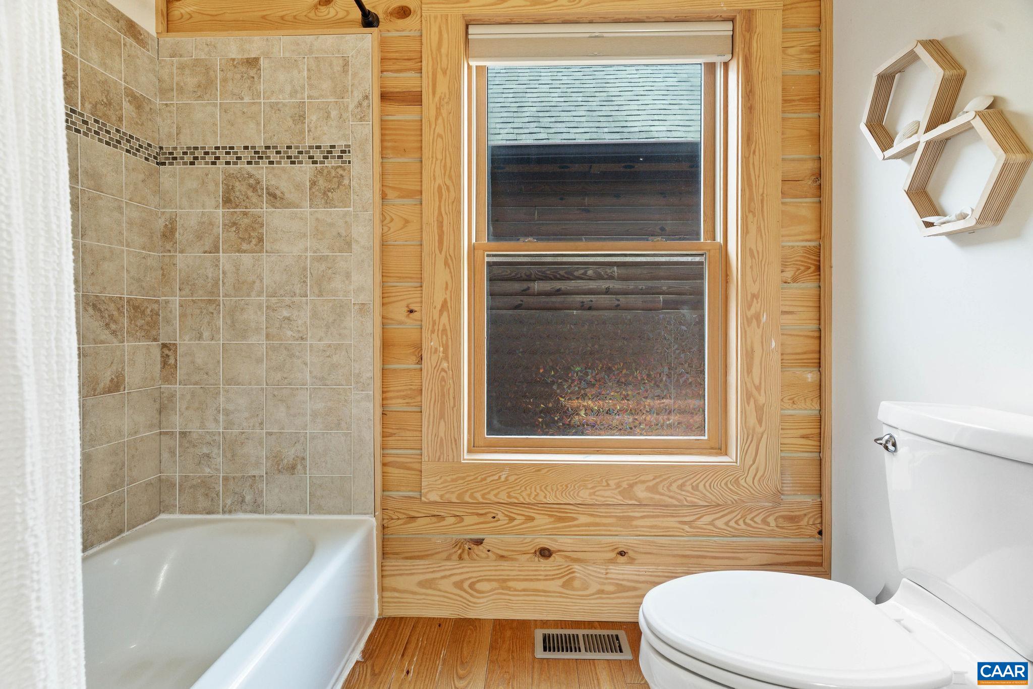42 River Ridge Lane Stanardsville, VA 22973 - Photo 43 of 70 a bathroom with a toilet and a bathtub