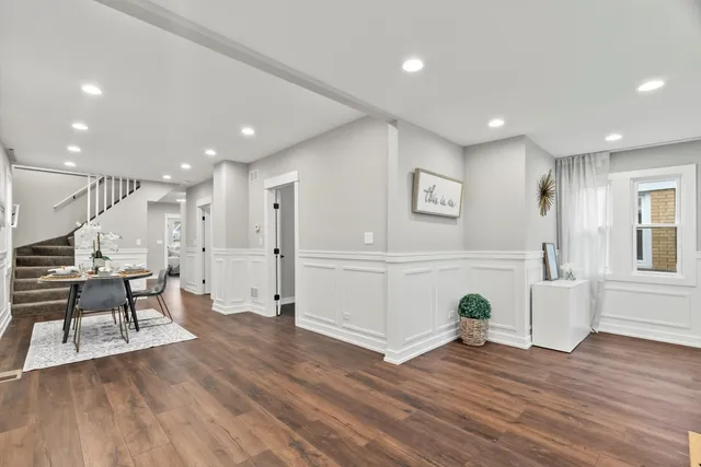 a view of kitchen with furniture and wooden floor