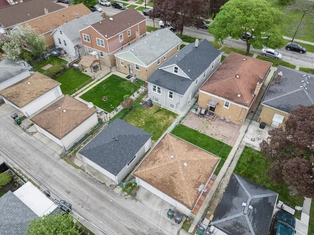 an aerial view of residential house with outdoor space and street view